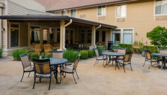 Outdoor tables and patio - Pavilion at Great Hills Senior Living