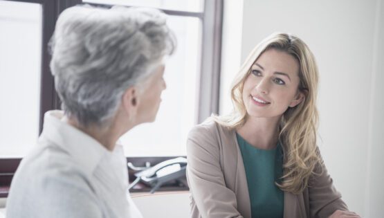 woman talking to an older woman