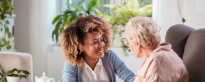 senior and care giver at The Pavilion at Great Hills Senior Living