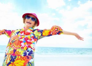 Woman smiling on the beach in the sunlight