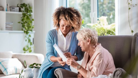 A nurse and a woman discuss a treatment plan at The Pavillion at Great Hills