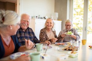 Older Adults Happily Eating Together