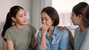 Daughters talking to mother