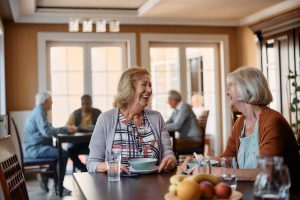 Adult women talking at dinner