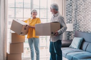 Happy seniors moving