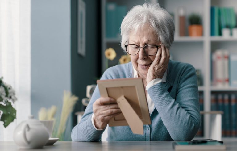 Woman with dementia looking at a picture