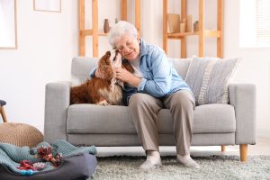 Joyful older woman with her companion pet