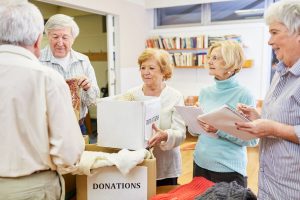 Group of older adults volunteering at a senior living community