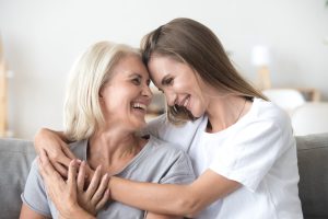 Mother and daughter hugging each other