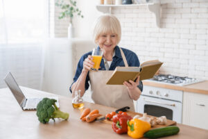 Senior woman reading a recipe book